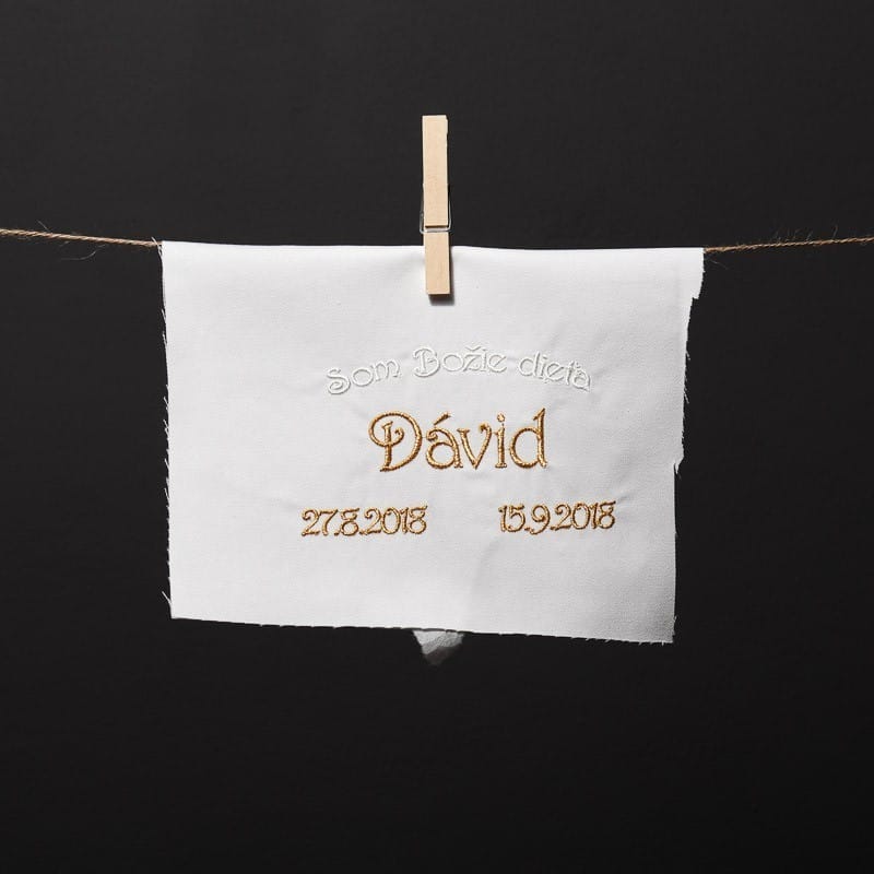 embroidered name and dates; embroidered text: "I am a child of God"