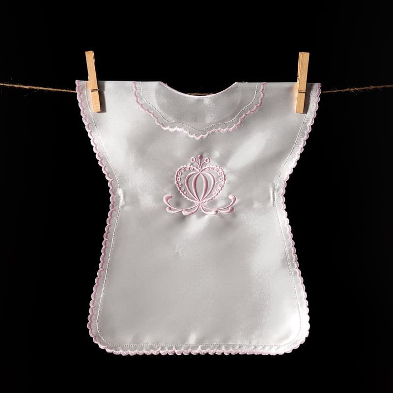 Sleeveless satin christening gown with folk-style heart embroidery